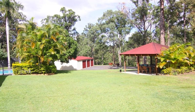 yard toward gazebo, shed and pool